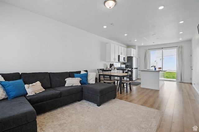 98 E Stroll Ave Unit 809, Saratoga Springs, UT 84045 - living room featuring light wood finished floors and recessed lighting