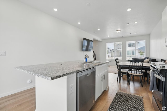 98 E Stroll Ave Unit 809, Saratoga Springs, UT 84045 - kitchen with appliances with stainless steel finishes, light wood-type flooring, white cabinetry, an island with sink, and recessed lighting