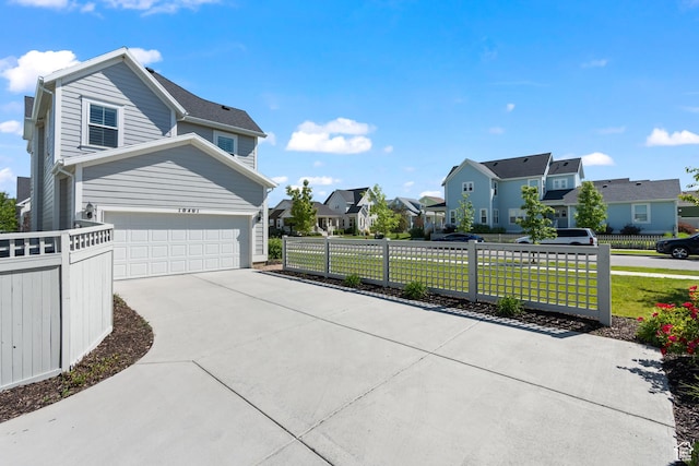 10401 S Liffey Ln, South Jordan, UT 84009 - view of side of property featuring a residential view, an attached garage, and concrete driveway