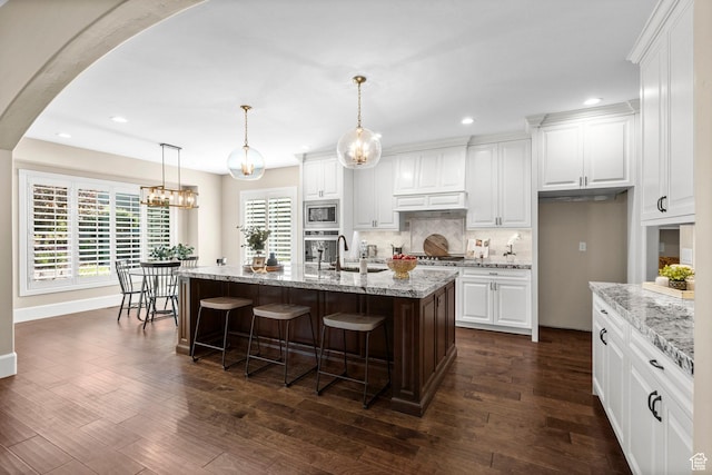 2209 E Viscaya Dr, Draper, UT 84020 - kitchen featuring stainless steel appliances, recessed lighting, decorative backsplash, white cabinets, and dark wood finished floors
