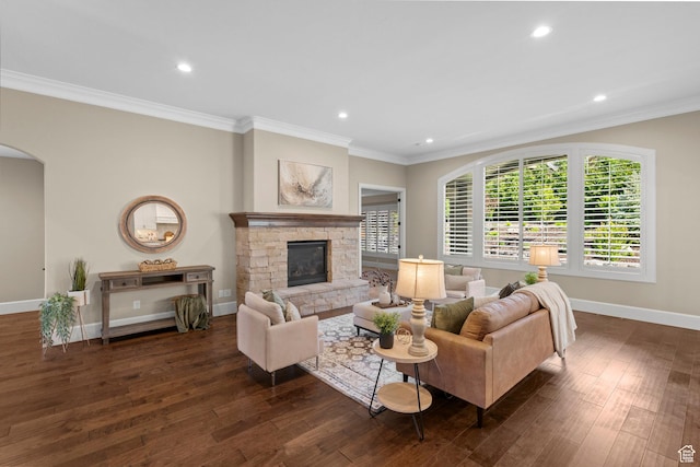 2209 E Viscaya Dr, Draper, UT 84020 - living area with dark wood finished floors, arched walkways, a stone fireplace, recessed lighting, and crown molding