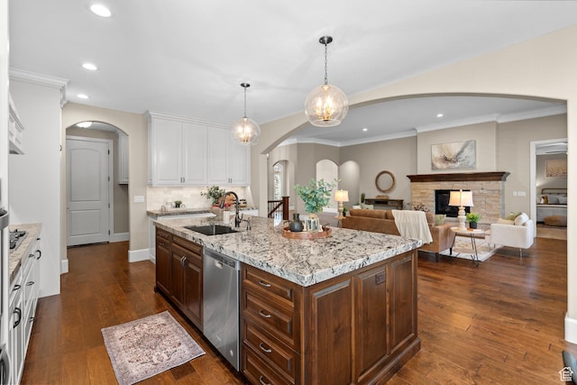 2209 E Viscaya Dr, Draper, UT 84020 - kitchen featuring stainless steel dishwasher, arched walkways, white cabinetry, recessed lighting, and an island with sink