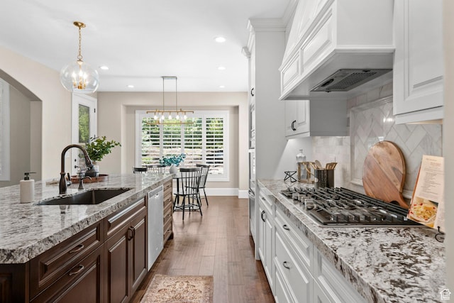 2209 E Viscaya Dr, Draper, UT 84020 - kitchen with stainless steel appliances, custom exhaust hood, arched walkways, white cabinets, and recessed lighting