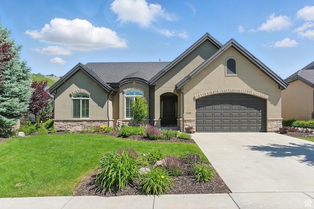 2209 E Viscaya Dr, Draper, UT 84020 - french country style house with stone siding, a garage, a front lawn, stucco siding, and driveway