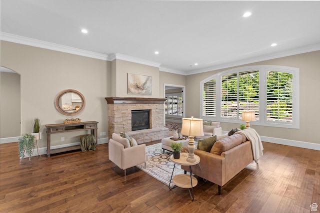 2209 E Viscaya Dr, Draper, UT 84020 - living room featuring dark wood-style floors, crown molding, a fireplace, recessed lighting, and arched walkways
