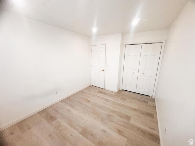 5351 S Royal Autumn Cir, Taylorsville, UT 84129 - unfurnished bedroom with wood finished floors and a closet