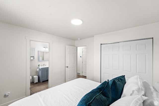 1726 W 1375 N, Layton, UT 84041 - bedroom featuring wood finished floors, a closet, and connected bathroom