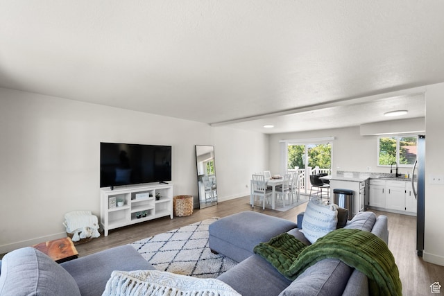 1726 W 1375 N, Layton, UT 84041 - living room featuring light wood-style flooring and baseboards