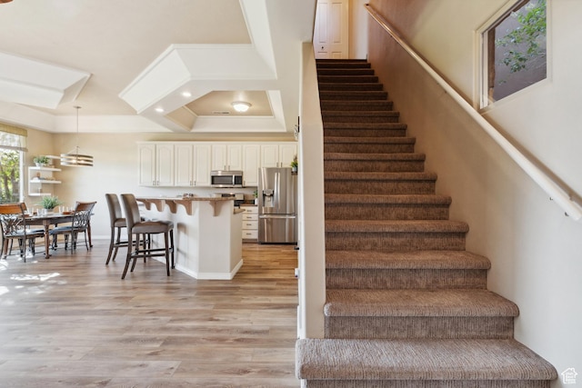 340 N Country Ln N Unit 27, St George, UT 84770 - staircase with wood finished floors, crown molding, and recessed lighting
