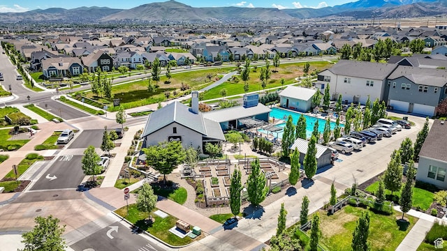 6366 W Sugarcane Dr S Unit 310, South Jordan, UT 84009 - aerial perspective of suburban area featuring a pool area and a mountain backdrop
