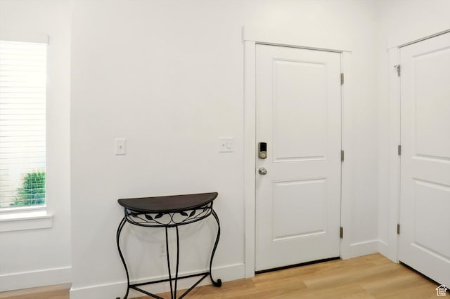 1754 N 300 E Unit 114, North Ogden, UT 84414 - foyer entrance with light wood-style flooring and baseboards