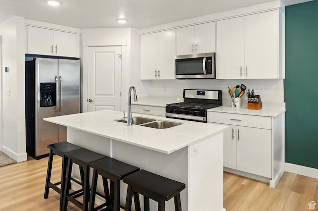 1754 N 300 E Unit 114, North Ogden, UT 84414 - kitchen featuring stainless steel appliances, light wood-style flooring, a kitchen breakfast bar, white cabinetry, and recessed lighting