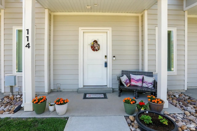 1754 N 300 E Unit 114, North Ogden, UT 84414 - view of exterior entry featuring a porch