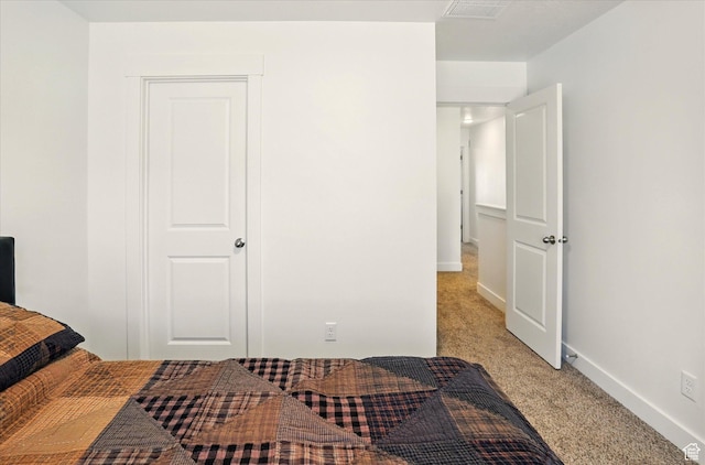 1754 N 300 E Unit 114, North Ogden, UT 84414 - bedroom featuring light carpet and baseboards