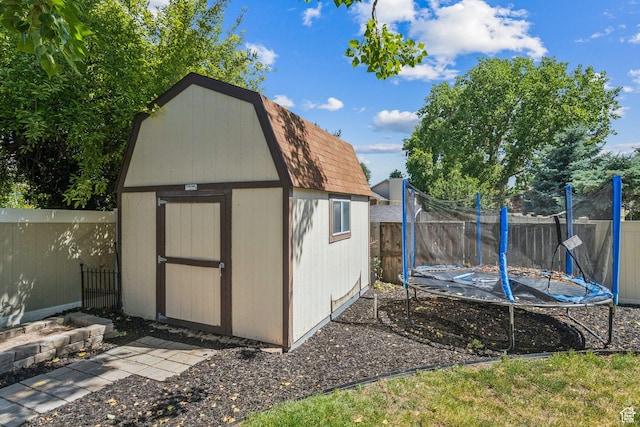 3285 W 6775 S, West Jordan, UT 84084 - view of shed featuring a trampoline and a fenced backyard
