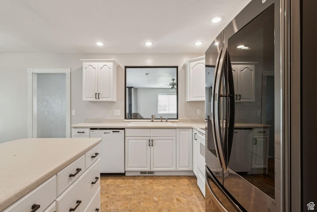 3285 W 6775 S, West Jordan, UT 84084 - kitchen featuring white dishwasher, light countertops, white cabinets, recessed lighting, and smart refrigerator