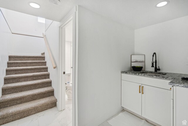 213 E 500 N, Nephi, UT 84648 - bar area with light marble finish flooring, stairs, and recessed lighting