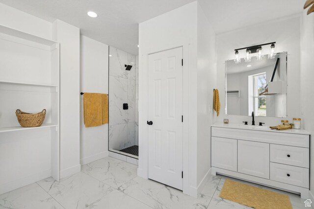 213 E 500 N, Nephi, UT 84648 - bathroom featuring marble finish flooring, a marble finish shower, vanity, and recessed lighting