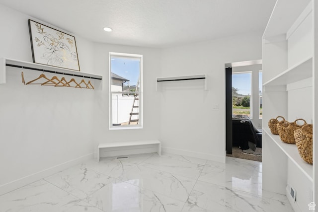 213 E 500 N, Nephi, UT 84648 - mudroom with healthy amount of natural light, marble finish flooring, and recessed lighting