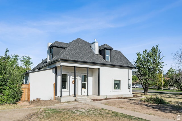213 E 500 N, Nephi, UT 84648 - view of front of home featuring stucco siding, a chimney, and a shingled roof