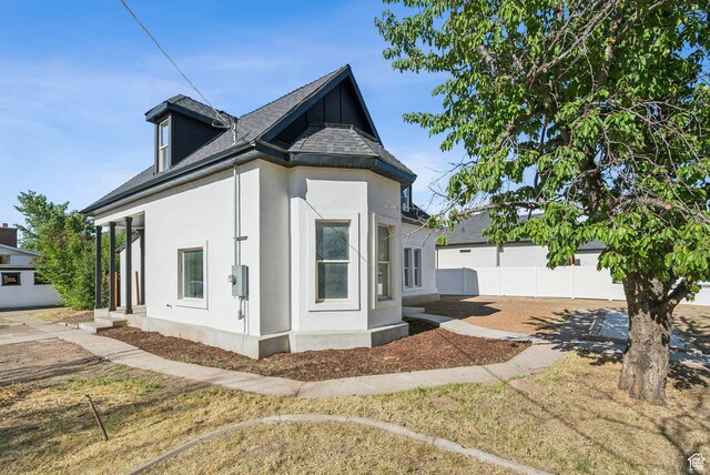 213 E 500 N, Nephi, UT 84648 - view of home's exterior with stucco siding and roof with shingles
