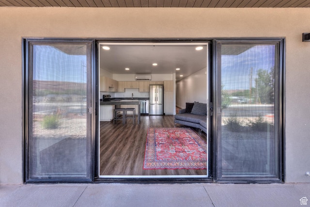 443 W Kane Creek Blvd Unit A104, Moab, UT 84532 - entrance to property featuring a wall unit AC and stucco siding