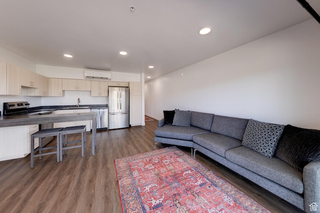 443 W Kane Creek Blvd Unit A104, Moab, UT 84532 - living room with a wall unit AC, dark wood finished floors, and recessed lighting