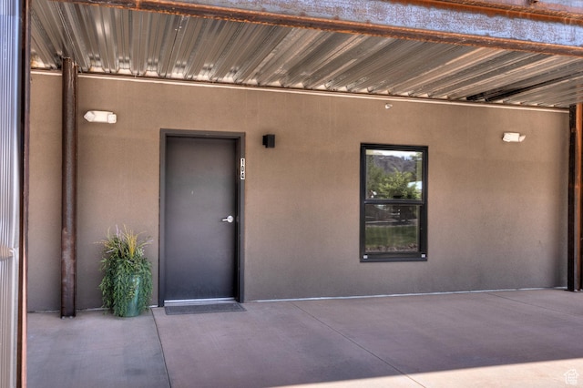 443 W Kane Creek Blvd Unit A104, Moab, UT 84532 - doorway to property with stucco siding and a patio area