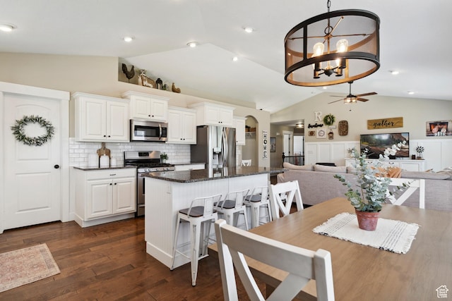 1412 S 4175 W, Syracuse, UT 84075 - dining area with lofted ceiling, ceiling fan, dark wood-style flooring, and a chandelier