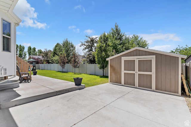 1412 S 4175 W, Syracuse, UT 84075 - fenced backyard with a patio and a storage shed