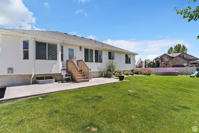 1412 S 4175 W, Syracuse, UT 84075 - back of property with a patio area, stucco siding, and a playground