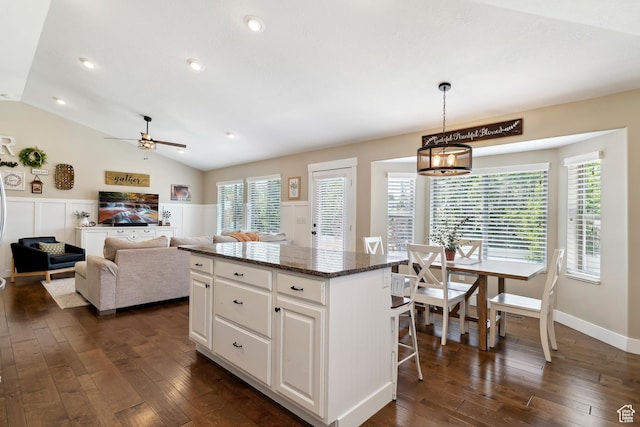 1412 S 4175 W, Syracuse, UT 84075 - kitchen featuring dark wood-type flooring, a kitchen island, ceiling fan, white cabinets, and lofted ceiling