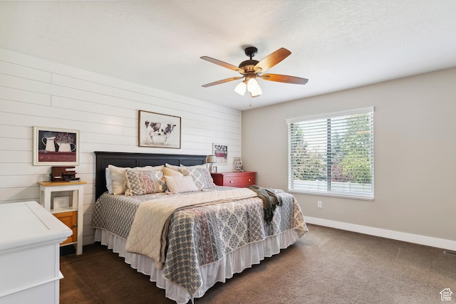 1412 S 4175 W, Syracuse, UT 84075 - bedroom with dark carpet, ceiling fan, a textured ceiling, and wooden walls