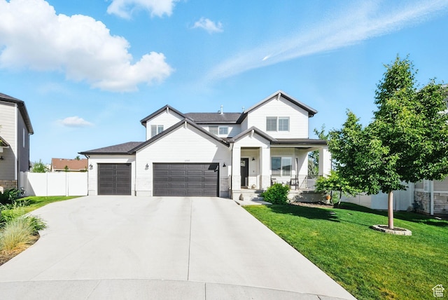 4888 W Transcendent Ct, West Jordan, UT 84081 - view of front of home with an attached garage, a porch, and driveway