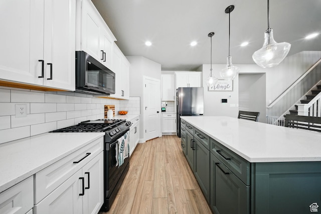 4888 W Transcendent Ct, West Jordan, UT 84081 - kitchen with black range with gas stovetop, white cabinets, light wood finished floors, light countertops, and recessed lighting