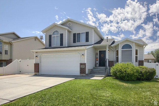 2595 W 4000 S, Roy, UT 84067 - view of front of house featuring brick siding, concrete driveway, and a garage