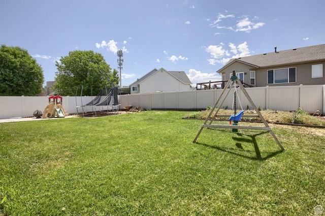 2595 W 4000 S, Roy, UT 84067 - fenced backyard with a trampoline and a playground