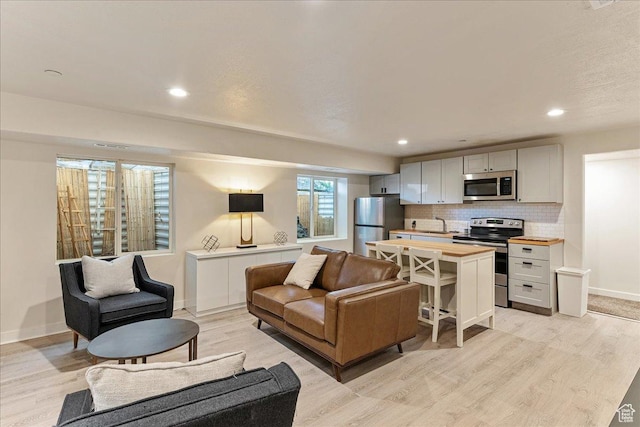 1794 E Longbranch Dr, Draper, UT 84020 - living area featuring light wood finished floors and recessed lighting