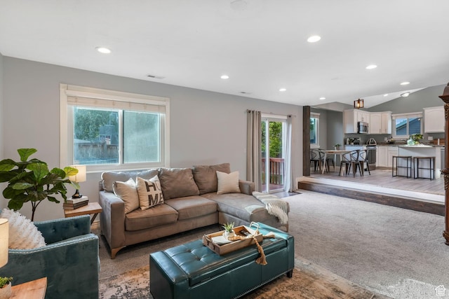 7839 N Apache Ln E, Eagle Mountain, UT 84005 - living room with plenty of natural light, light colored carpet, recessed lighting, and lofted ceiling