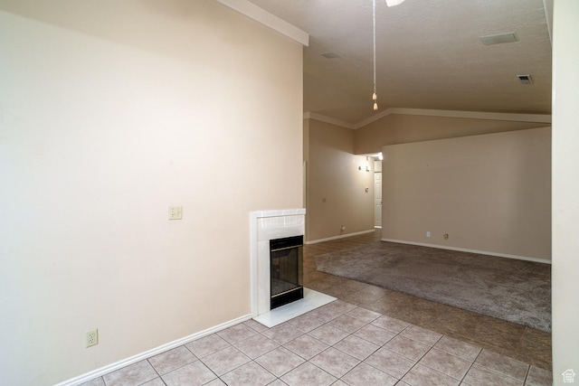 301 S 1200 E Unit 64, St George, UT 84790 - unfurnished living room featuring light tile patterned flooring, vaulted ceiling, a glass covered fireplace, and light carpet