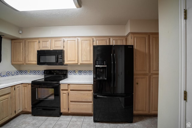 301 S 1200 E Unit 64, St George, UT 84790 - kitchen featuring black appliances, tile countertops, light brown cabinetry, and light tile patterned flooring