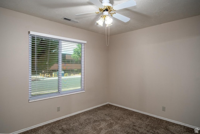 301 S 1200 E Unit 64, St George, UT 84790 - spare room with dark colored carpet, a ceiling fan, and a textured ceiling