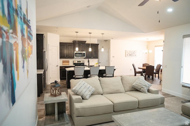1060 N Ocotillo Dr, Washington, UT 84780 - living room with lofted ceiling, ceiling fan, recessed lighting, and wood finished floors