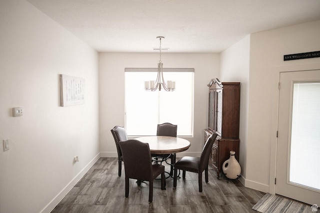 1060 N Ocotillo Dr, Washington, UT 84780 - dining area with a chandelier and dark wood-style floors