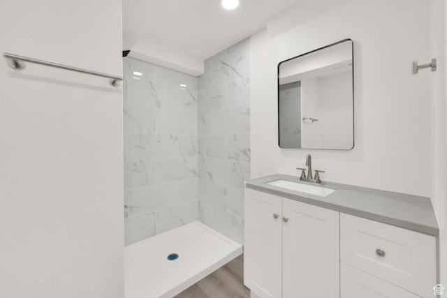 3042 W 8565 S, West Jordan, UT 84088 - bathroom with vanity, recessed lighting, tiled shower, and wood finished floors