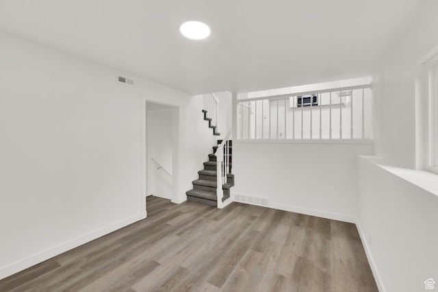 3042 W 8565 S, West Jordan, UT 84088 - spare room featuring wood finished floors and stairway