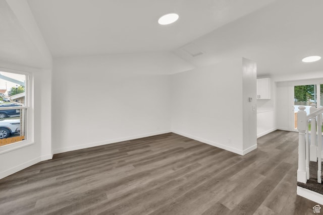 3042 W 8565 S, West Jordan, UT 84088 - unfurnished living room featuring lofted ceiling and dark wood finished floors