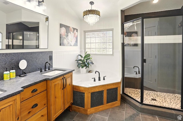 7414 S Regal Dr, West Jordan, UT 84081 - bathroom featuring a shower stall, wainscoting, double vanity, a garden tub, and tile patterned flooring