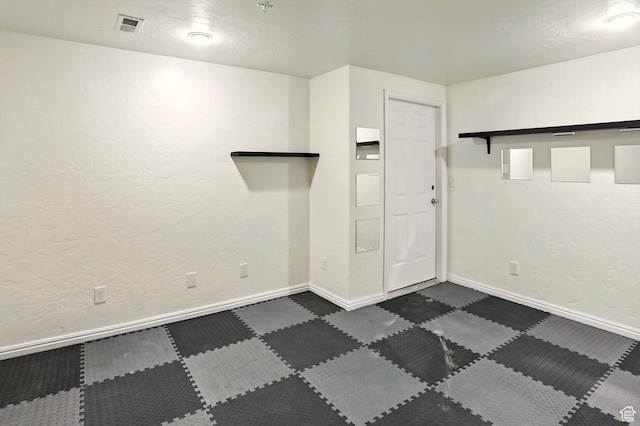 7414 S Regal Dr, West Jordan, UT 84081 - empty room featuring baseboards and dark carpet