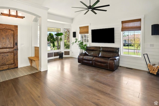 7414 S Regal Dr, West Jordan, UT 84081 - living room featuring dark wood-type flooring, ceiling fan, arched walkways, and lofted ceiling